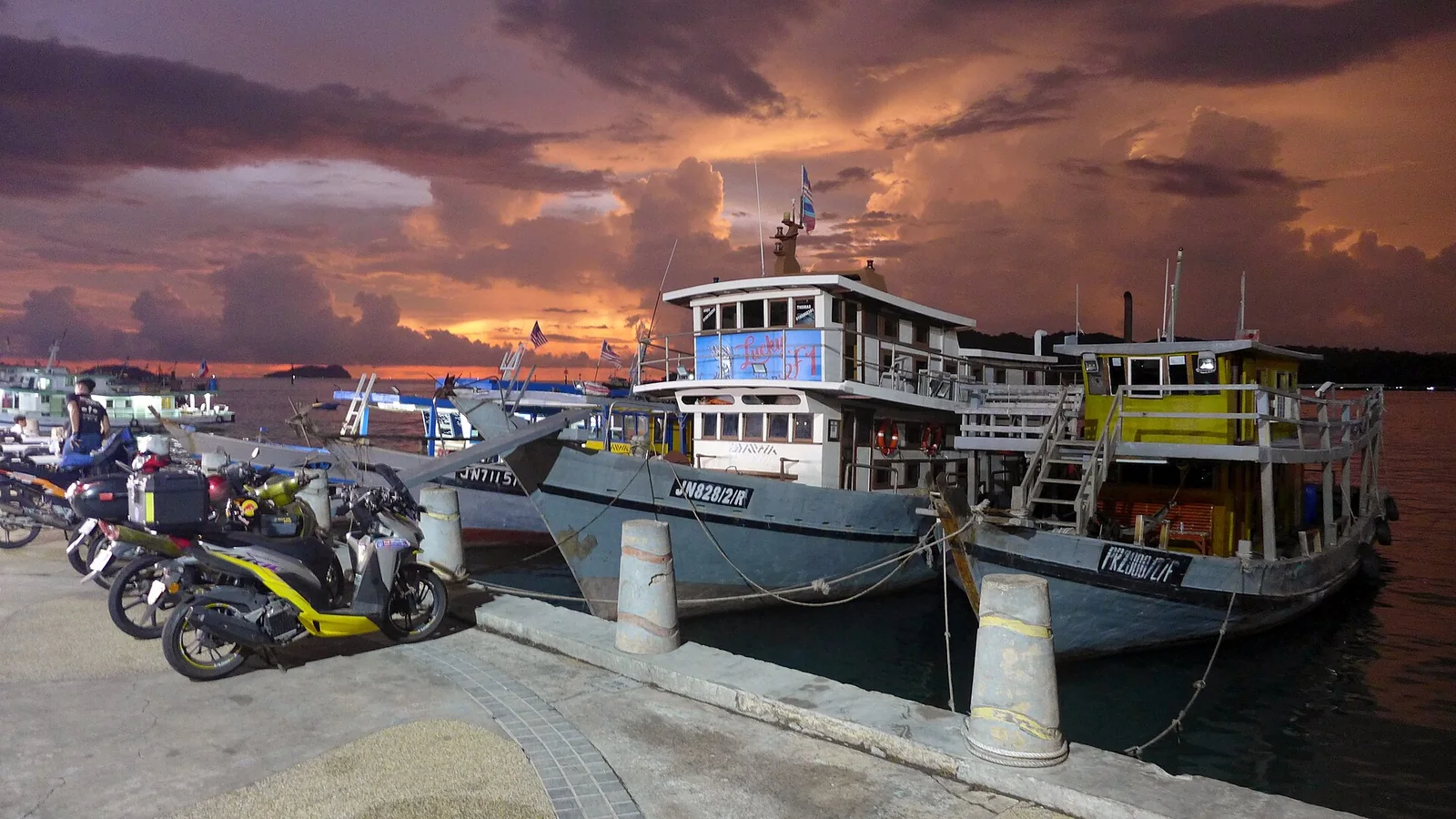 Boats along the Kota Kinabalu waterfront at sunset